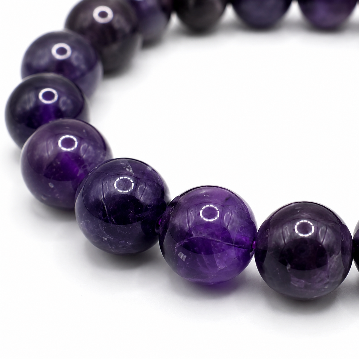 Close-up of the violet amethyst beads and elastic threading