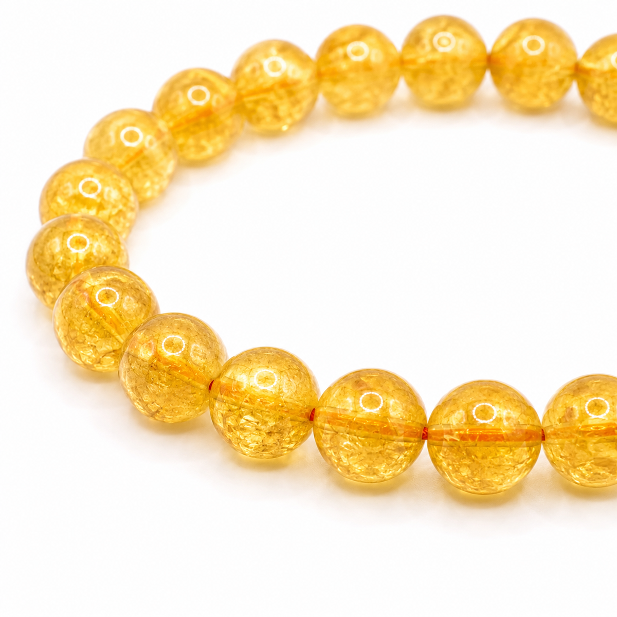 Close-up of the golden yellow citrine beads and elastic threading