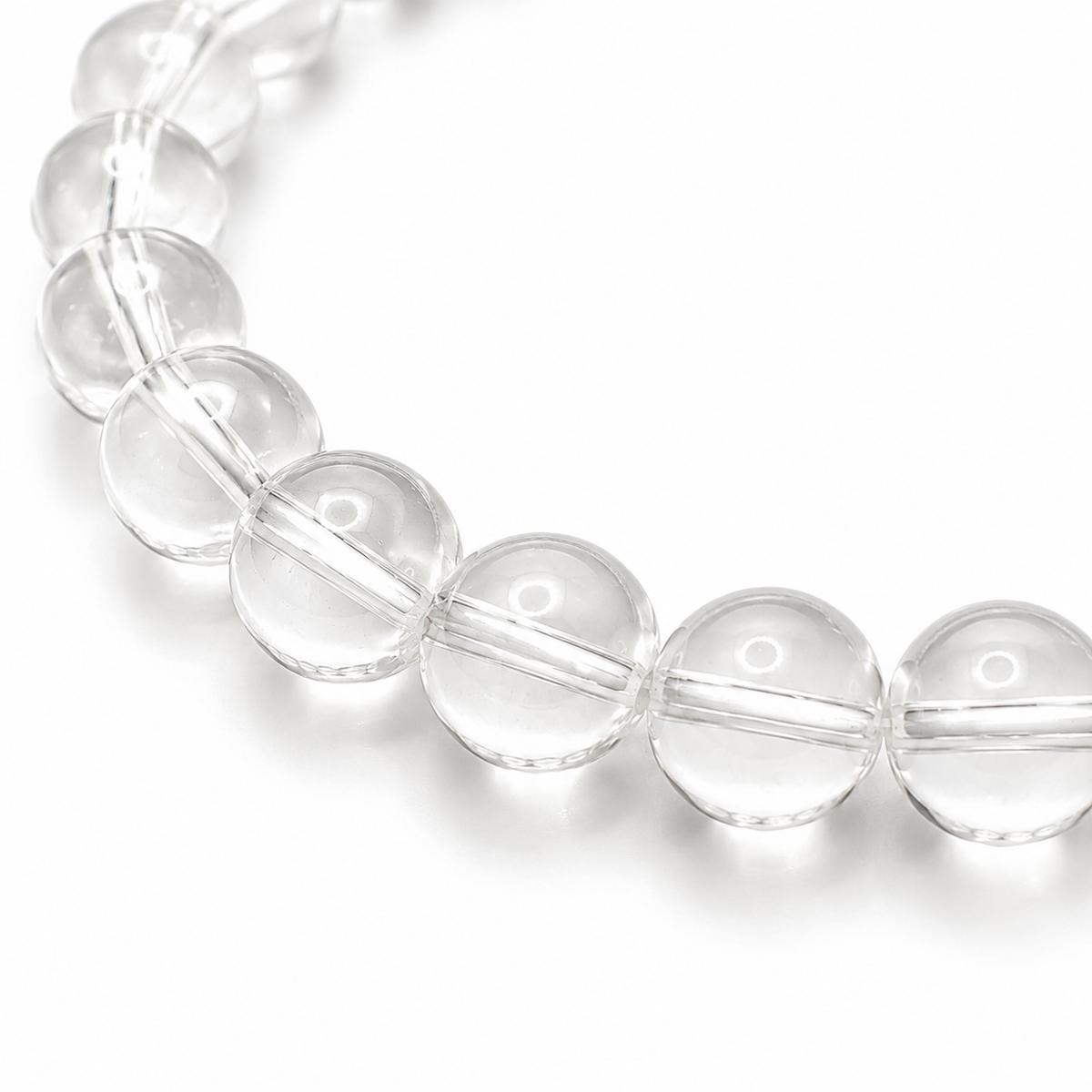 Close-up of the translucent clear quartz beads and elastic threading
