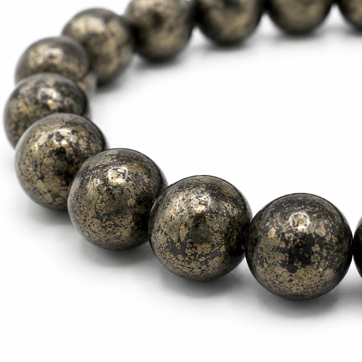 Close-up of the metallic gold pyrite beads and elastic threading