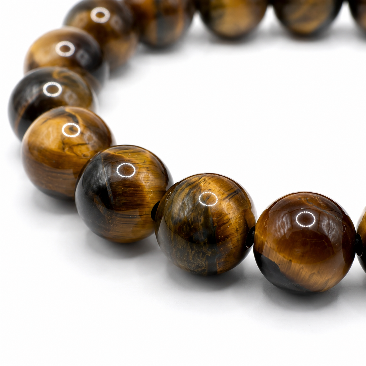 Close-up of the banded golden brown tiger eye beads and elastic threading